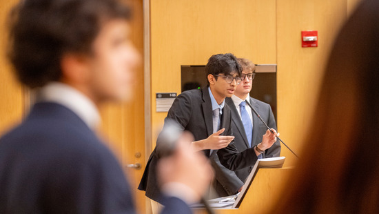 Student presents at a podium