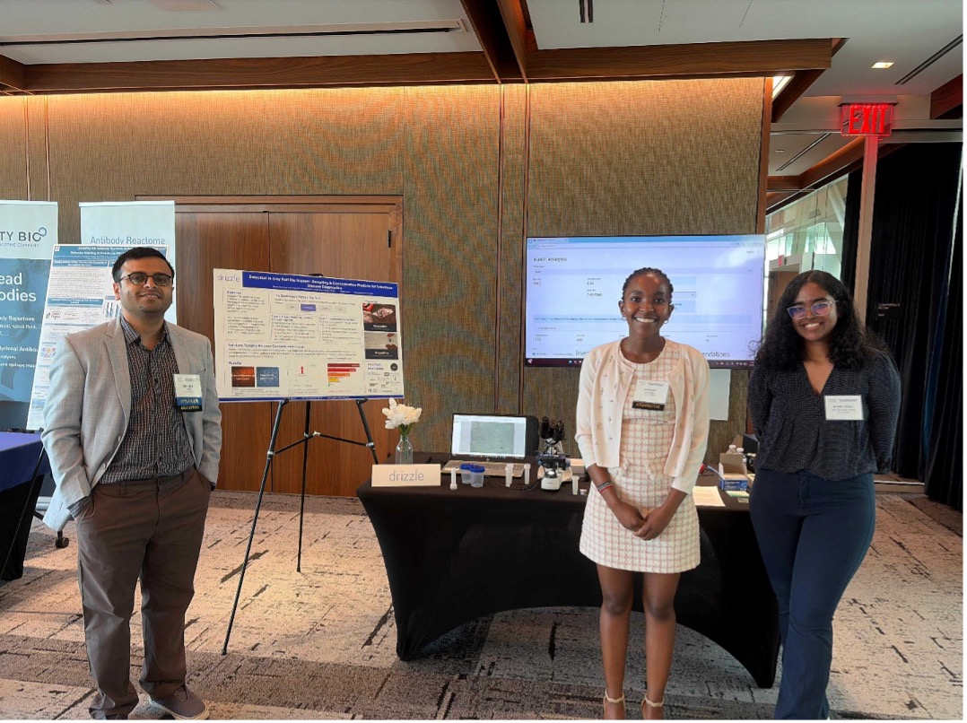 Bonolo Mathekga and her team presenting the work on a poster