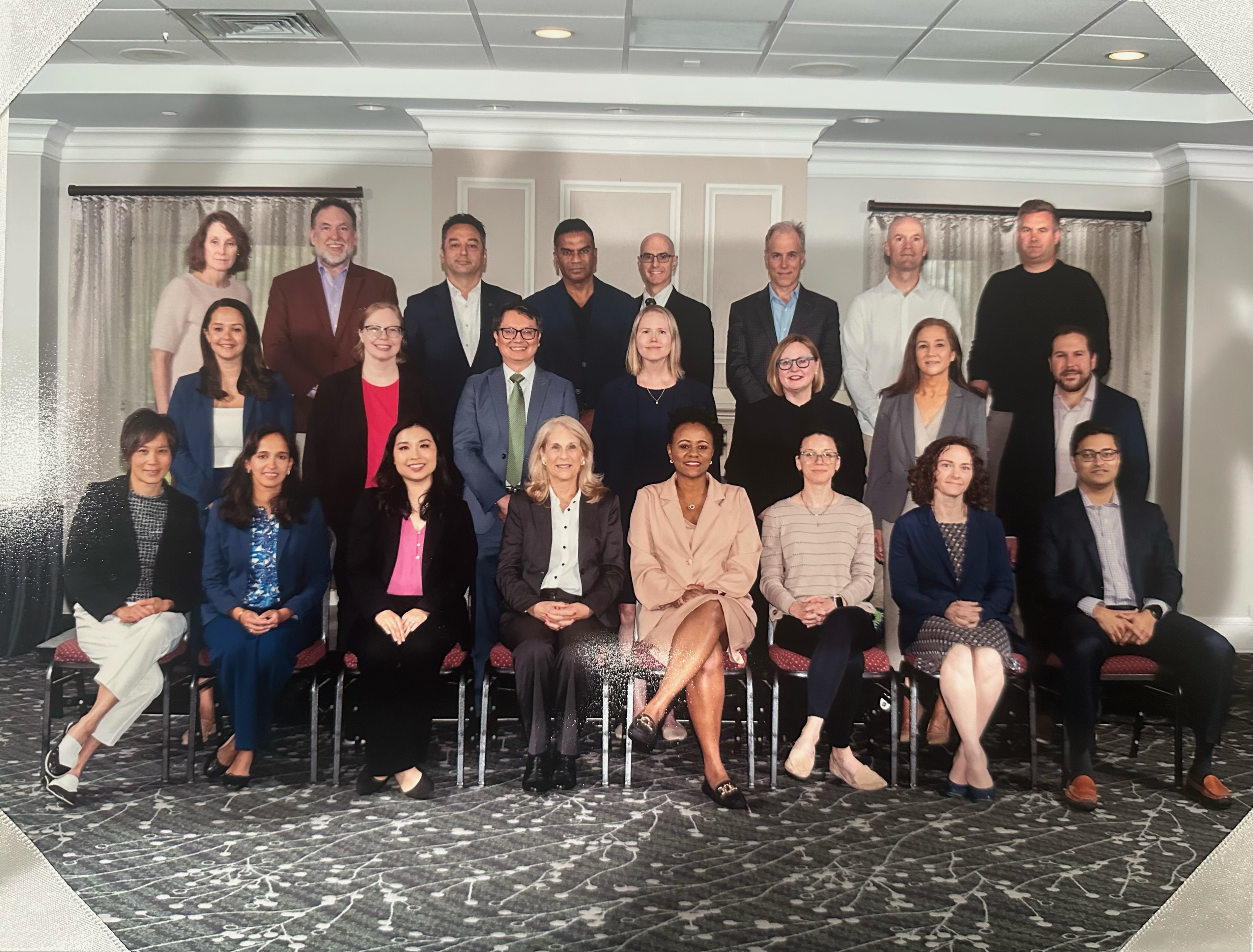 A group of conference participants sitting and standing together